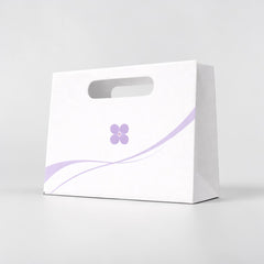 Paper carrier bag with cut-out handle