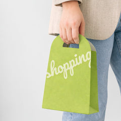 Shopping paper bag with rounded cut handle
