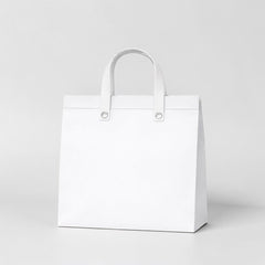 Stockk large white non-woven tote bag with reinforced handles, ideal for premium packaging and gifts.