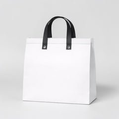 Stockk large white non-woven polypropylene tote bag with black handles, ideal for restaurants and boutiques.