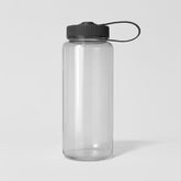 Stockk transparent Tritan water bottle with black screw-on lid and carrying strap. Ideal for sports and travel.