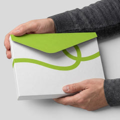 Stockka A4 envelope folder with green triangular flap and wavy line design, made of cardboard.