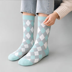 Stockka mid-calf socks in argyle pattern. Soft, breathable cotton blend in aqua, grey, and white. Ideal for casual wear.