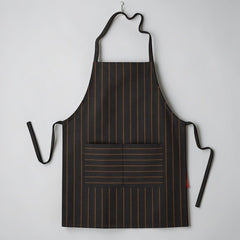 Stockka black and gold pinstripe full-length apron with adjustable neck strap and front pocket. Polyester-cotton blend.