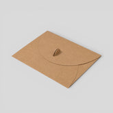Stockka brown kraft envelope with round closure and metal clip, ideal for invitations, certificates, and branding.