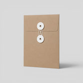Stockka brown kraft paper envelope with white string and disc closure, ideal for documents and invitations.
