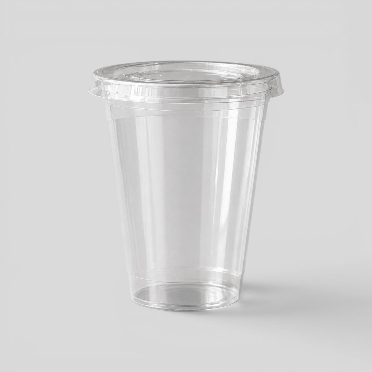 Stockka clear PET plastic cup with flat lid, ideal for cold drinks like iced coffee, smoothies, and juices.