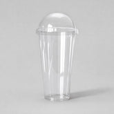Stockka tall clear PET plastic cup with dome lid, ideal for smoothies and cold drinks.