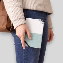 Stockka compact notebook with spiral binding on the corner, elastic closure, and custom design. Features 80 lined pages and a soft cover.