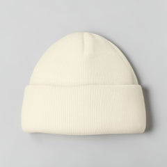 Stockka cream acrylic ribbed knit beanie. Unisex, double-knit for warmth and style.