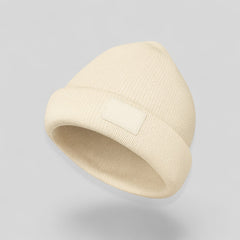 Stockka cream acrylic knit beanie with a blank logo patch. Double knit for warmth and style.