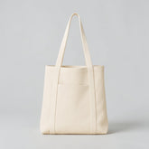 Stockka cream canvas tote bag with long shoulder straps and a wide front pocket. Ideal for everyday use or branding.