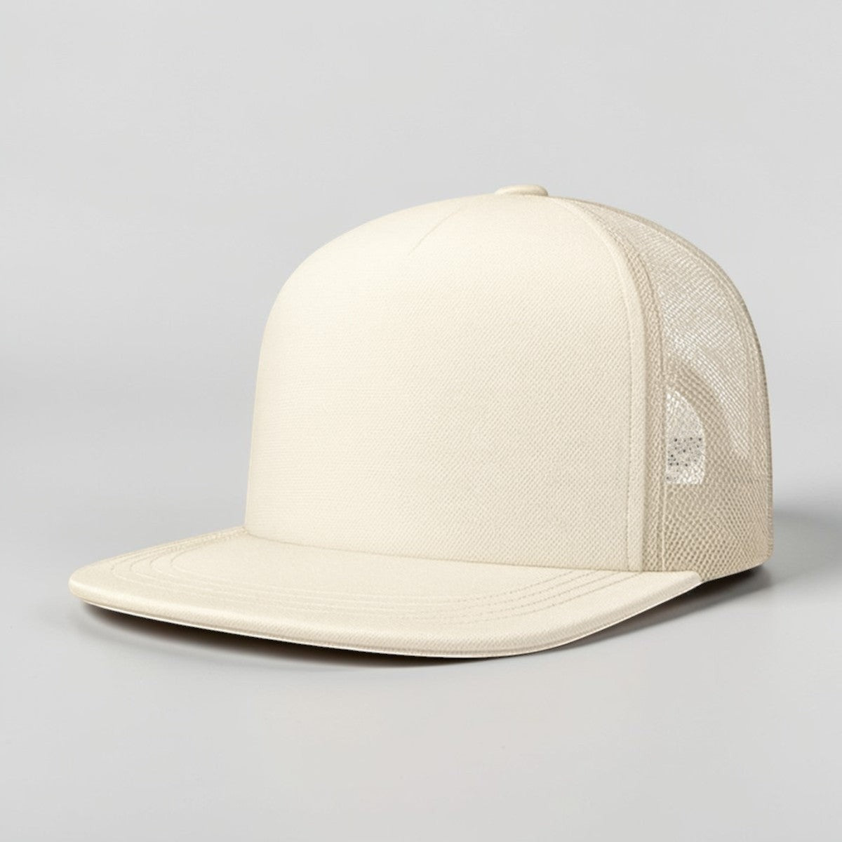 Stockka cream cotton mesh trucker hat with flat brim and structured front panel.
