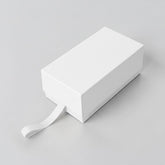 Stockka cream rectangular gift box with drawer-style opening and ribbon pull. Rigid cardboard with lamination.