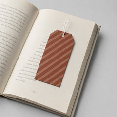 Stockka customisable bookmark with a hole for a string, featuring a diagonal stripe pattern in brown and tan.