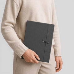 Stockka dark grey presentation folder made of corrugated cardboard with button and string closure for documents.