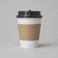 Stockka double-walled white paper coffee cup with black lid and brown kraft paper sleeve for hot beverages.