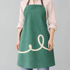 Stockka modern full-length green polyester twill apron with a cream swirl design and adjustable neck strap.