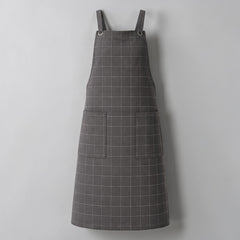 Stockka dark grey checkered cotton-polyester work apron with two large front pockets and metal ring shoulder straps.