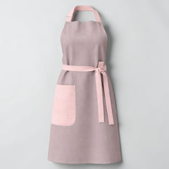 Stockka elegant grey cotton-polyester blend apron with pink trim and side pocket. Adjustable neck strap.