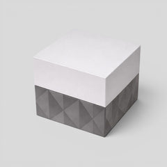Stockka cubic jewelry box with removable lid, matte finish, grey textured base and silver top.