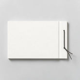 Stockka horizontal hard cover notebook with black string closure, 80 lined pages, customizable design.