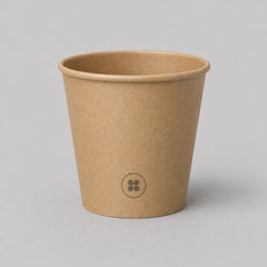 Stockka small minimalist brown kraft paper espresso cup with PE coating and a subtle circular logo.