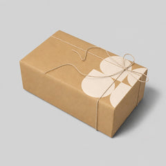 Stockka natural kraft cardboard gift box with twine tie and a subtle cream floral design.