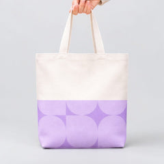 Stockka natural cotton canvas tote bag with a geometric lavender pattern on the bottom half. Ideal for everyday use or custom branding.