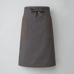 Stockka long dark grey waist apron with two side pockets, cotton-polyester blend, ideal for hospitality staff.