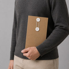 Stockka narrow brown kraft paper envelope with white string and disc closure, ideal for documents or gift vouchers.