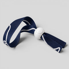 Stockka navy blue polyester wristband with white stripes and a white barrel lock closure, ideal for events.
