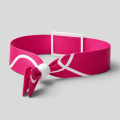 Stockka pink polyester wristband with white wavy lines and a white plastic buckle, featuring a PVC card with NFC chip.