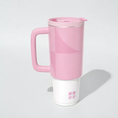 Stockka pink stainless steel thermal mug with handle and lid, double-walled for insulation.