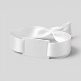 Stockka white polyester fabric wristband with PVC tag and plastic closure, ideal for events and festivals.