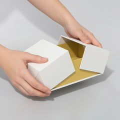 Stockka premium rigid box with double center opening, white exterior, yellow interior, ideal for luxury gifts.