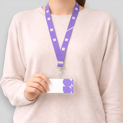 Stockka purple polyester lanyard with white flower pattern and clear ID card holder.