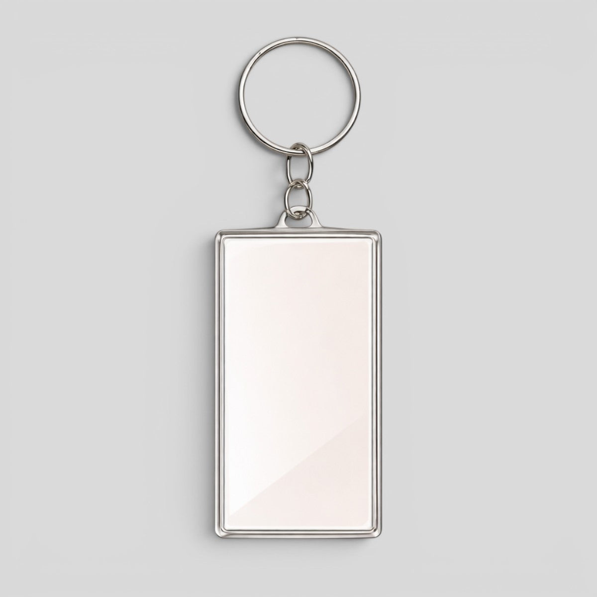 Stockka rectangular acrylic keychain with silver metal frame and ring, ideal for custom logos or photos.