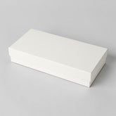 Stockka rectangular gift box, rigid cardboard with laminated finish, half white, half pink with geometric pattern. Ideal for cosmetics or accessories.