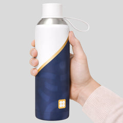 Stockka reusable water bottle, white and navy blue with gold accent, metal with plastic lid and handle, perfect for travel.
