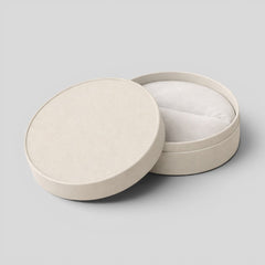 Stockka light grey round rigid cardboard jewelry box with removable lid and velvet lining. Ideal for rings, earrings, or custom branding.