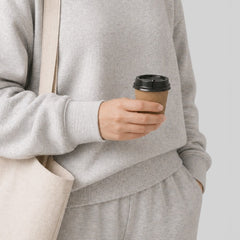 Stockka small brown paper espresso cup with black lid, ideal for events and tastings.