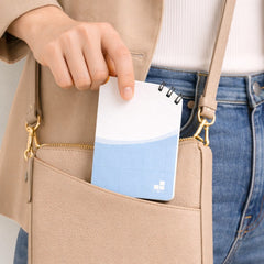 Stockka spiral notebook with soft cover, 80 lined pages, white and light blue design, perfect for on-the-go notes.