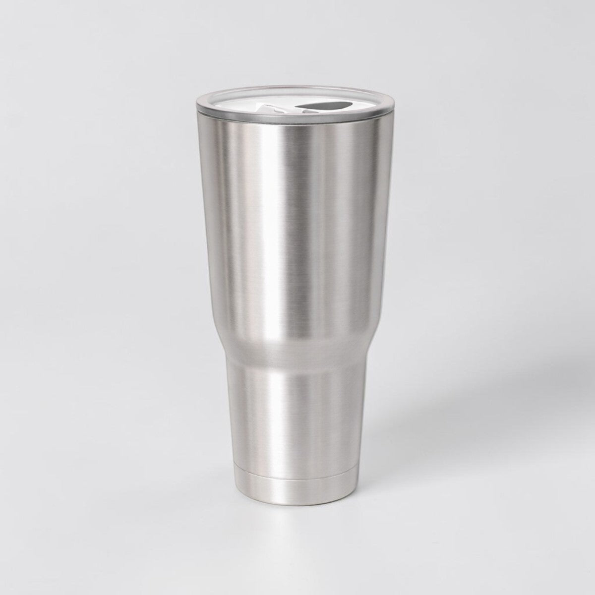 Stockka brushed stainless steel tumbler with flat lid, ideal for travel and office use.