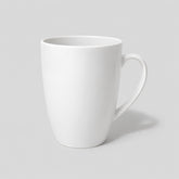 Stockka tall white ceramic mug with a tapered base and ergonomic handle for coffee or tea