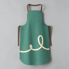 Stockka modern teal polyester twill apron with cream swirl design and brown straps. Full length with rounded hem.