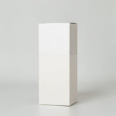 Stockka vertical wine box with top opening, made of coated cardboard with a light purple abstract swirl pattern.