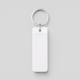 Stockka white rectangular acrylic keychain with metal ring, perfect for custom logos and branding.
