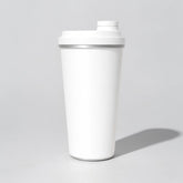Stockka white stainless steel thermal mug with blue screw-on lid and drinking spout, double-walled for hot drinks.