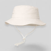 Stockka white cotton-polyester blend bucket hat with chin strap, ideal for surfing, beach, golf, and fishing.